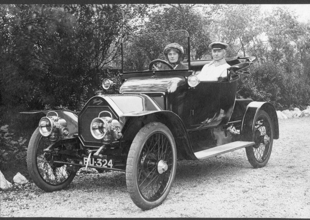 Photograph of Dr Olive Claydon, Oldham's first female GP and campaigner for women's health, in her car. The driver is possibly her brother Eric Claydon.
Image reference: P10248