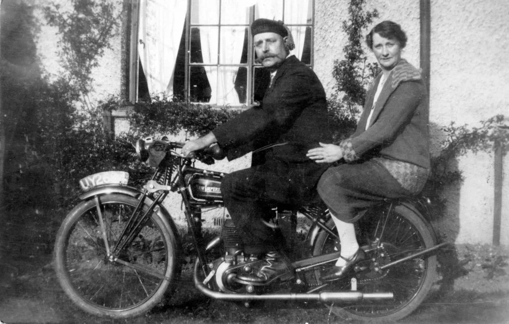 Photograph of Ralph Coltman and an unknown woman on a motorbike.
Image reference: P63236
