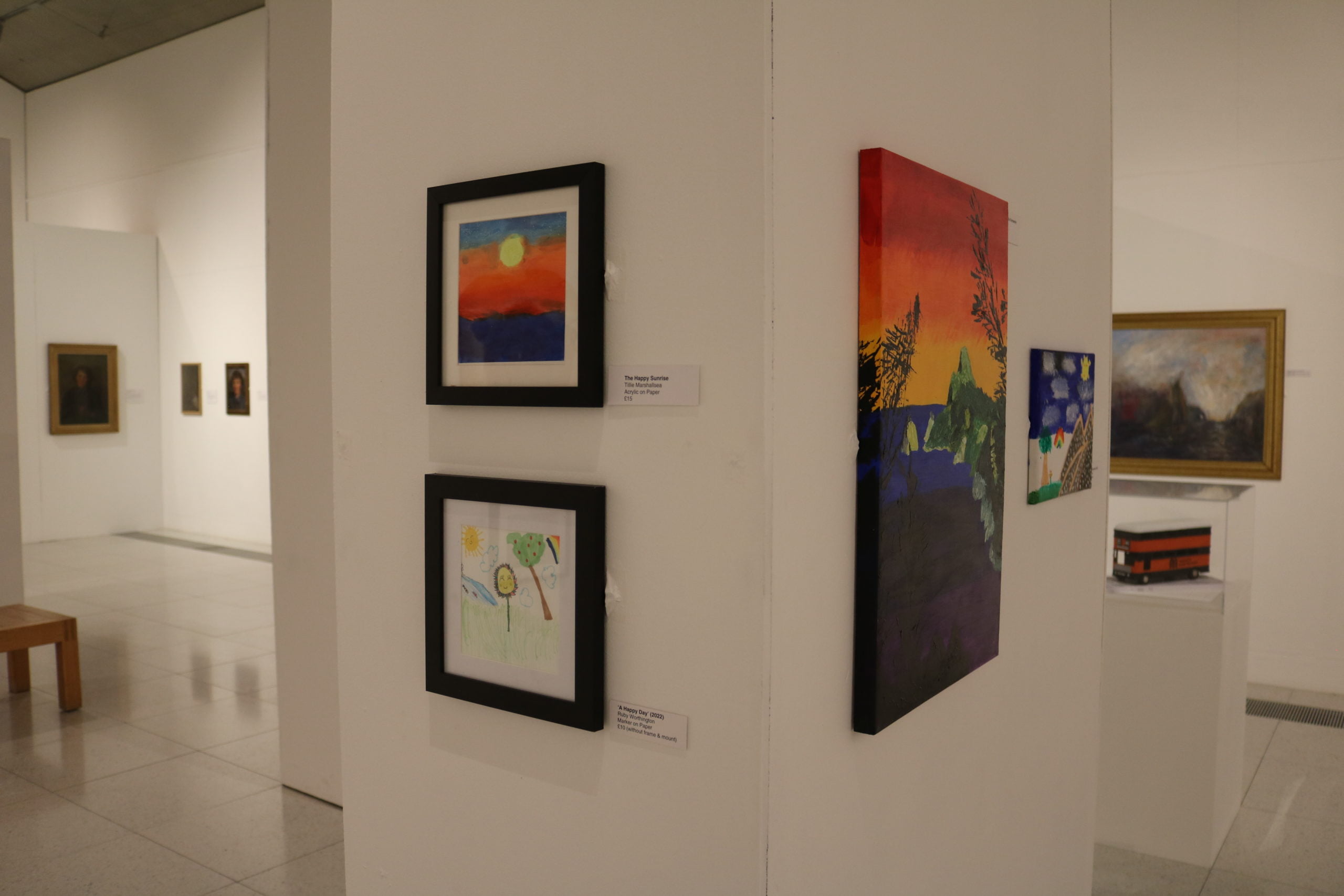 Photo of landscape artworks hung in the previous Oldham Open exhibition.